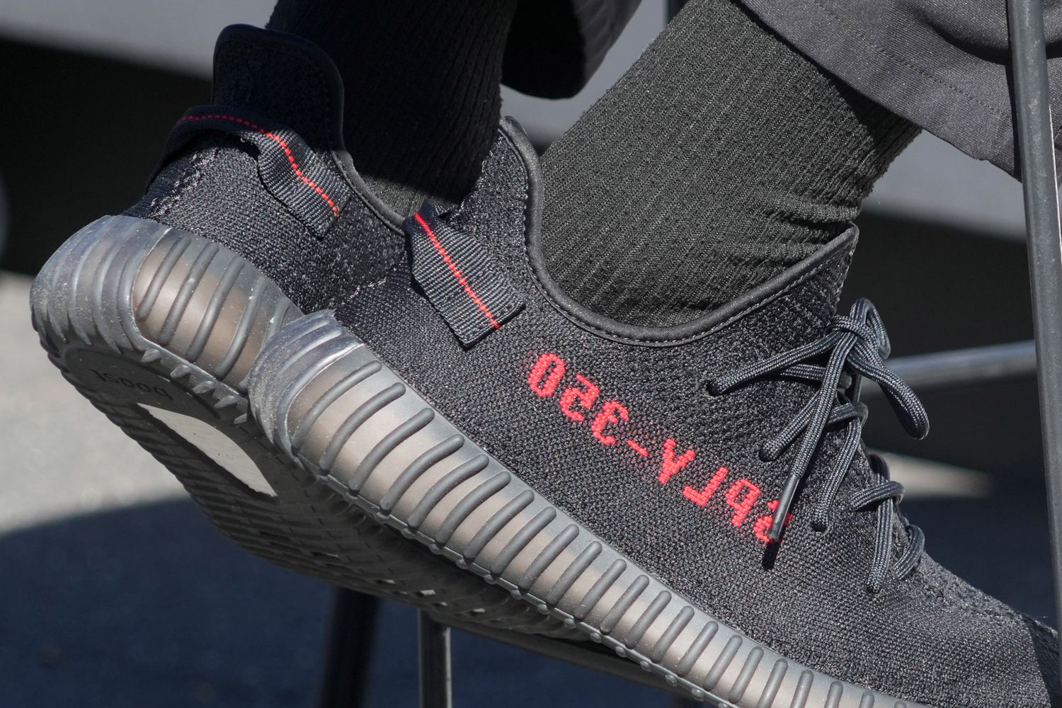 Black and red Yeezy shoes.